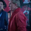 William Zabka Cobra Kai S06 Red Jacket